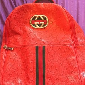 red stripped Gucci bag